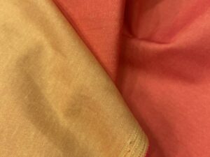 Kétoldalas elasztikus pamutvászon – korall / aranyhomok