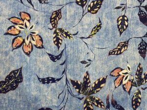 Koptatott hatású kék alapon levélmintás viszkóz flokon  Leírás: